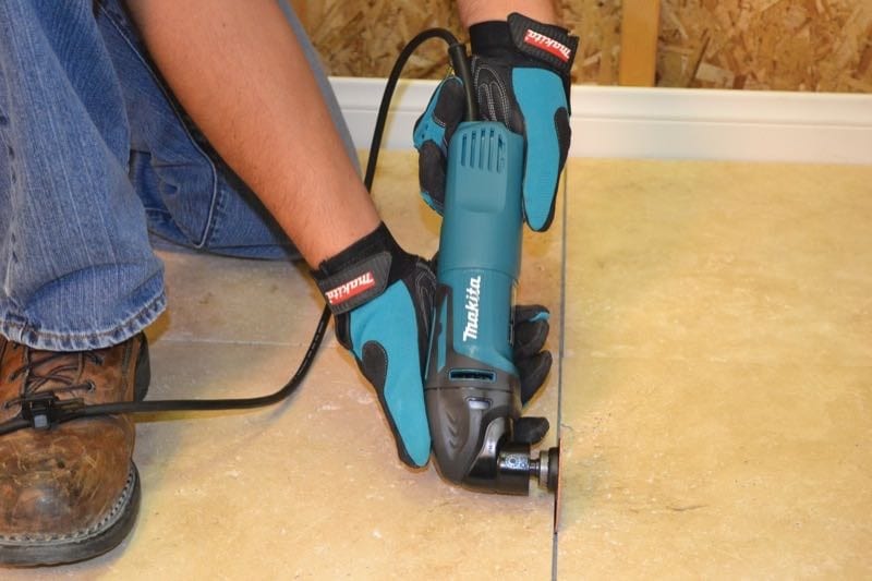 Makita TM3000CX5 oscillating multi-tool grout removal
