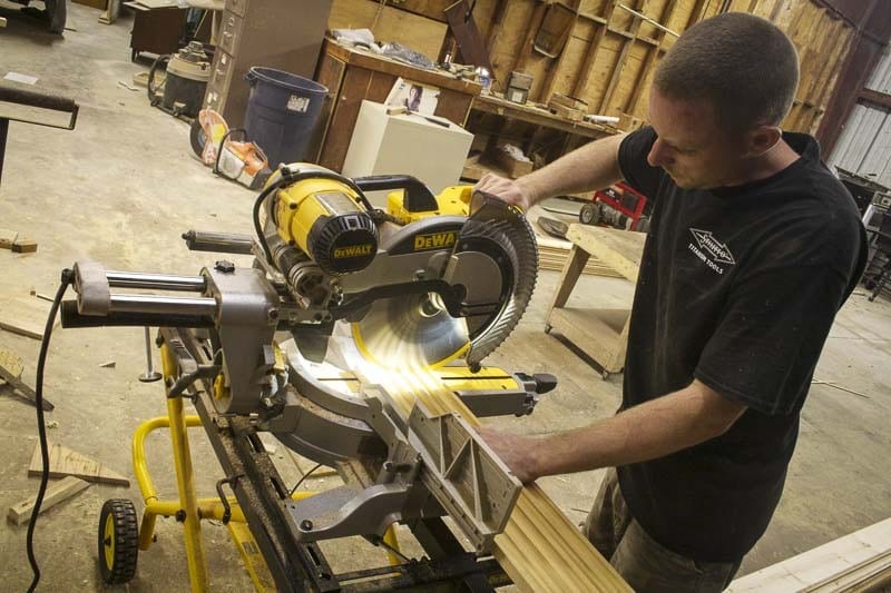 making cuts in the shop with a 12-inch miter saw