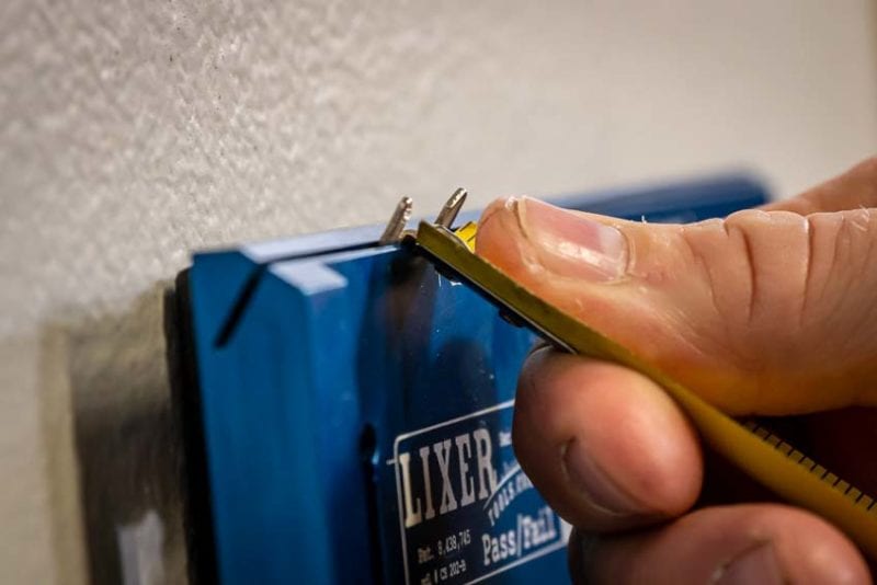 Tape measure end hook adjustment