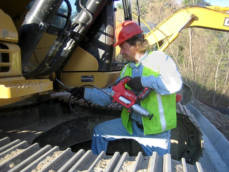 Milwaukee Grease Gun in use