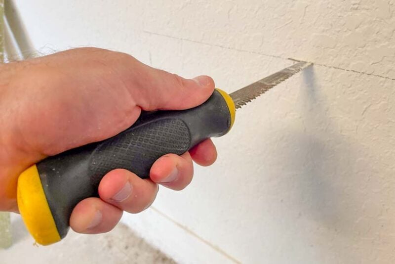 How to Patch Drywall Step 3 — Cut Out The Damage