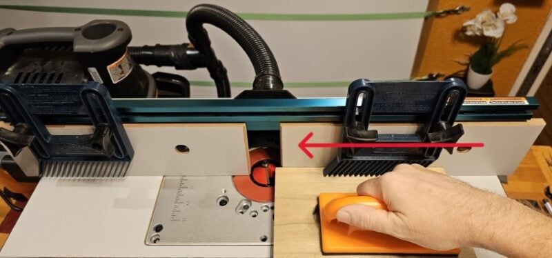 feeding wood through a router table