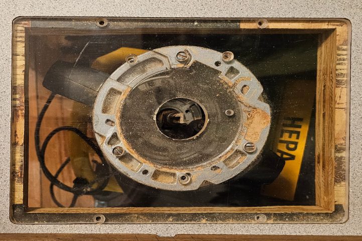 Acrylic table insert with a router in a router table